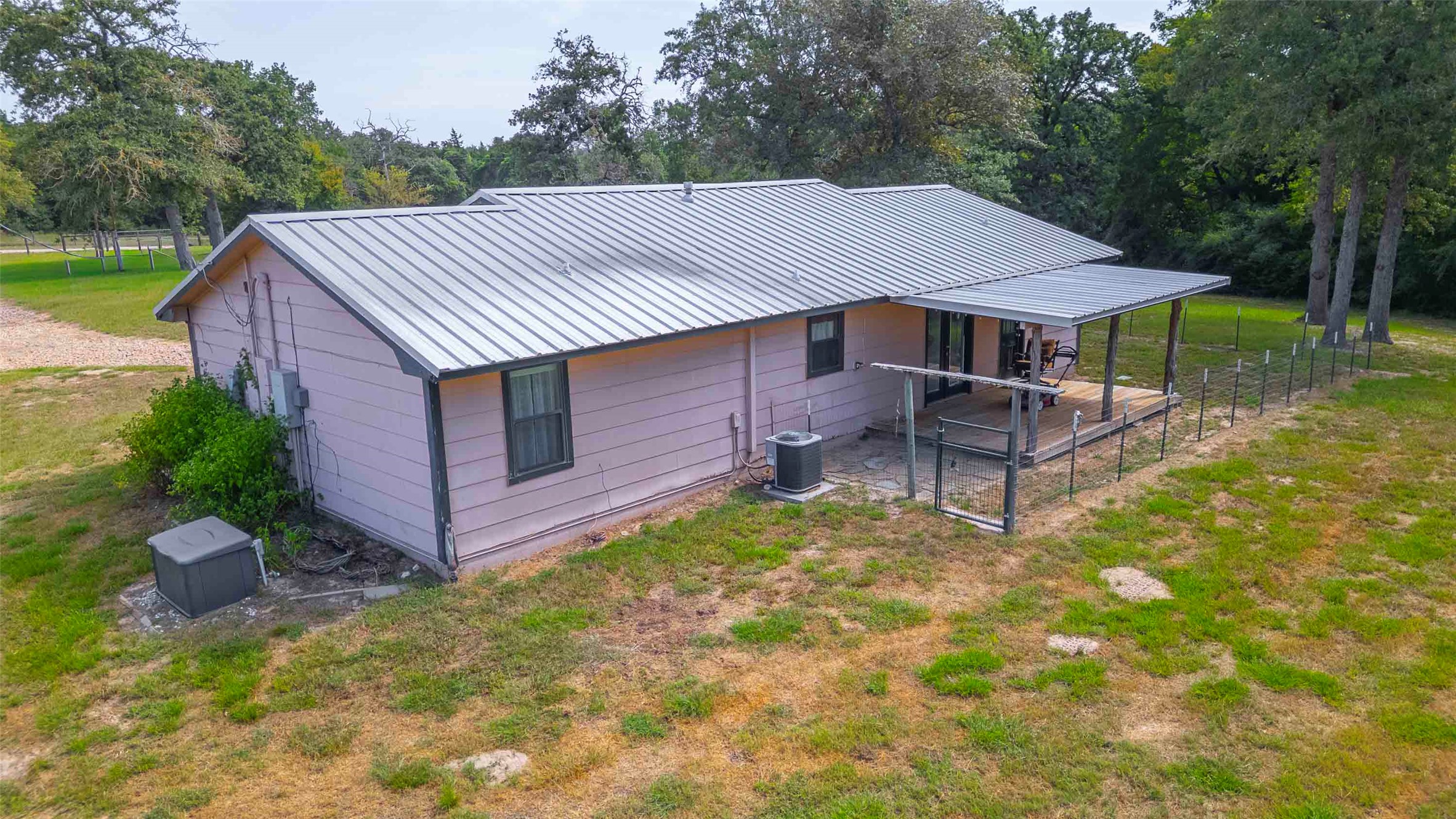 9695 County Road 321 Caldwell, TX 77836 - Photo 22 of 40 a view of a house with backyard and sitting area
