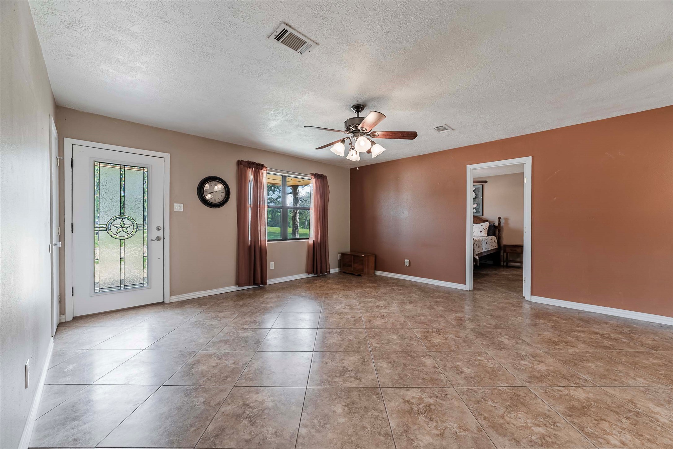 9695 County Road 321 Caldwell, TX 77836 - Photo 23 of 40 an empty room with fan and windows