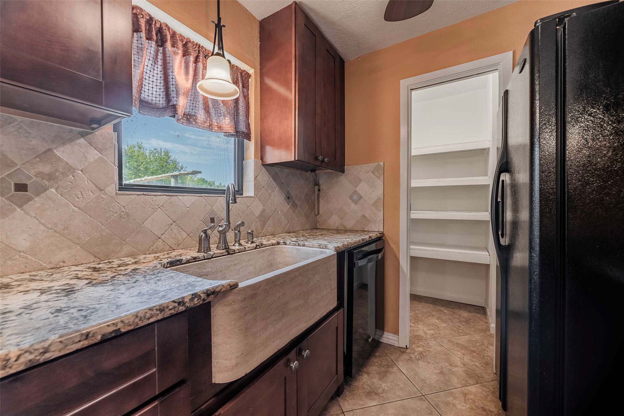 9695 County Road 321 Caldwell, TX 77836 - Photo 25 of 40 a bathroom with a granite countertop sink and a mirror