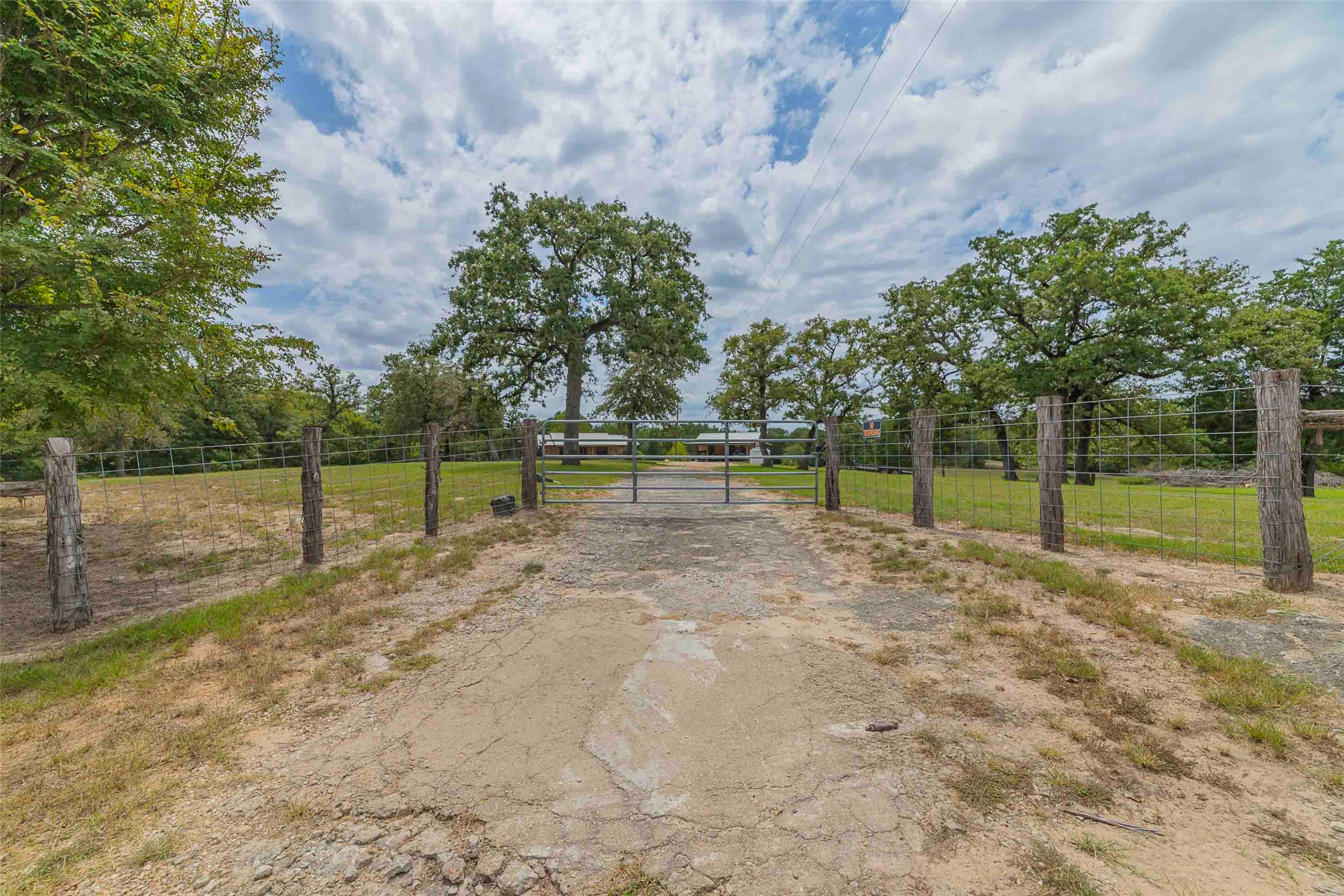 9695 County Road 321 Caldwell, TX 77836 - Photo 34 of 40 a view of a yard with swimming pool and large trees