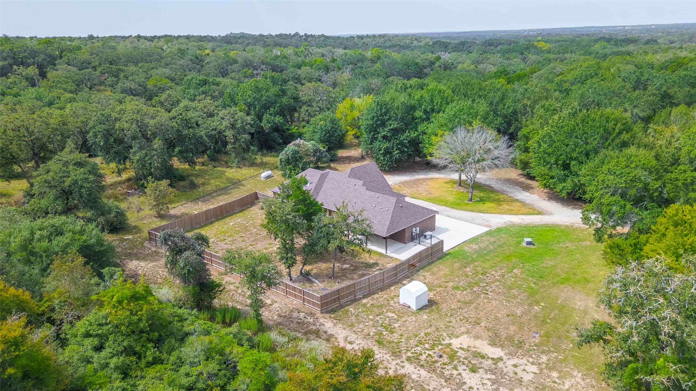 9695 County Road 321 Caldwell, TX 77836 - Photo 36 of 40 a view of a lake with a yard