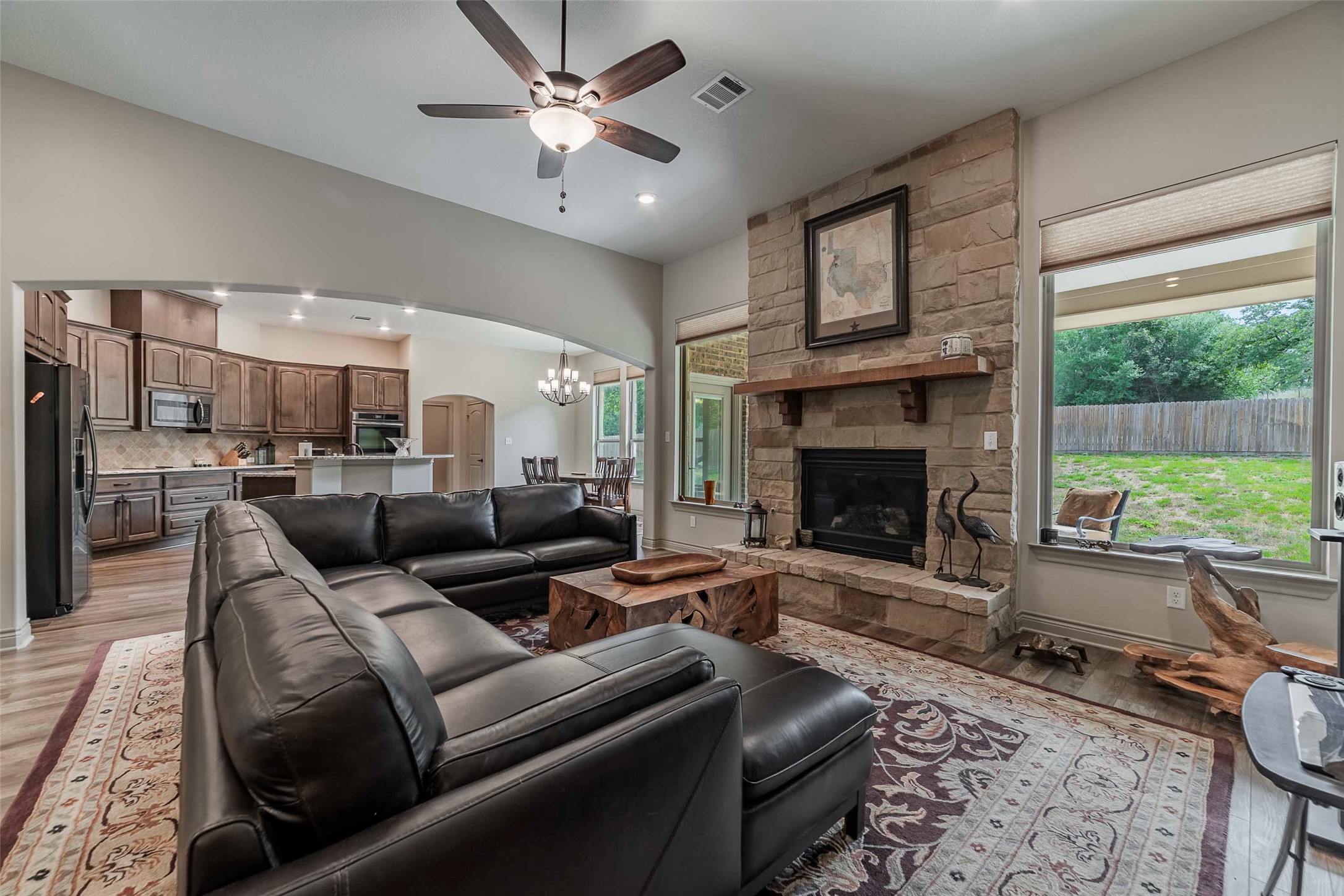 9695 County Road 321 Caldwell, TX 77836 - Photo 6 of 40 a living room with furniture wooden floor and a fireplace