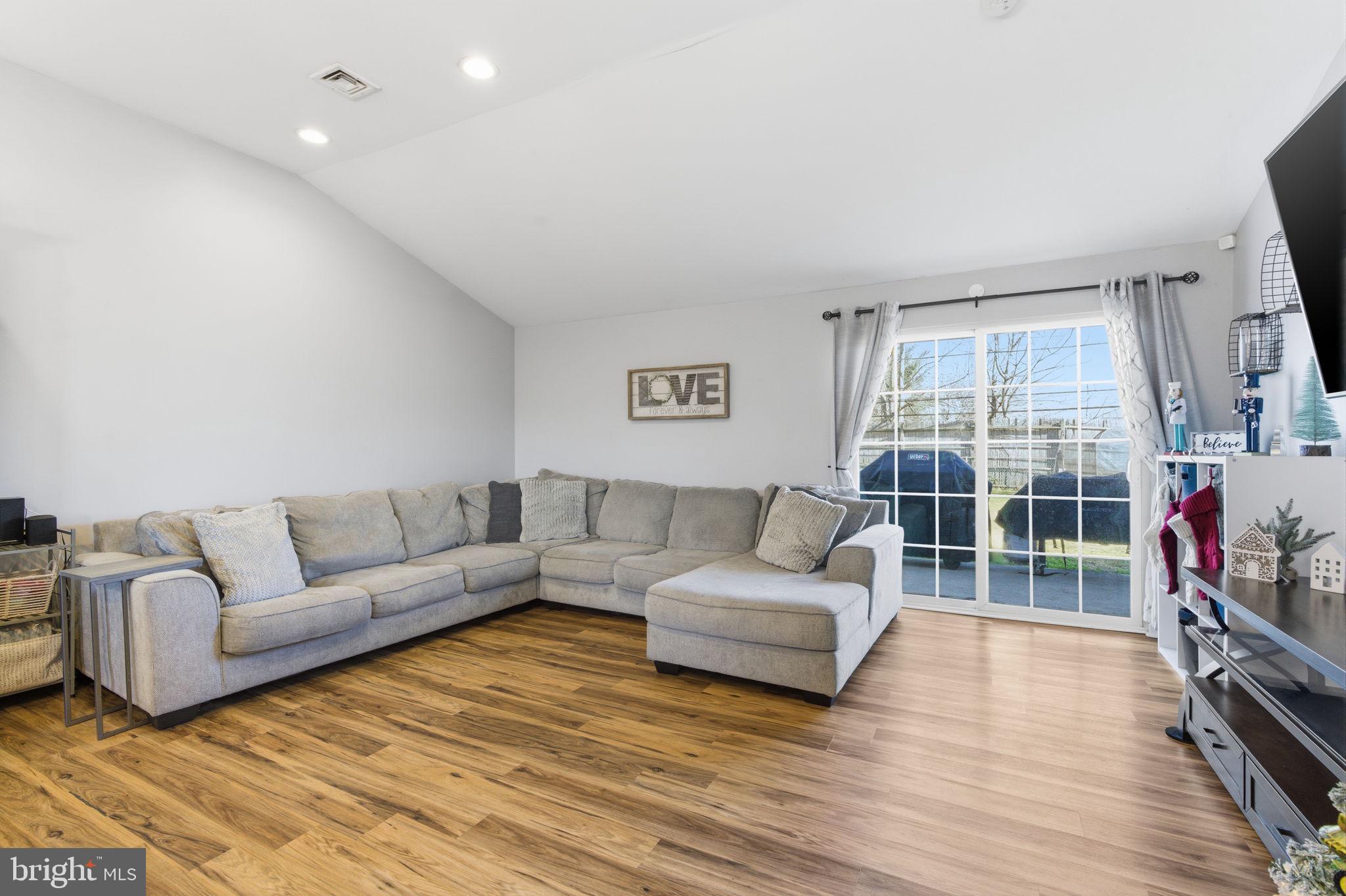 62 Oldbrook Road Levittown, PA 19057 - Photo 9 of 18 a living room with furniture and a flat screen tv