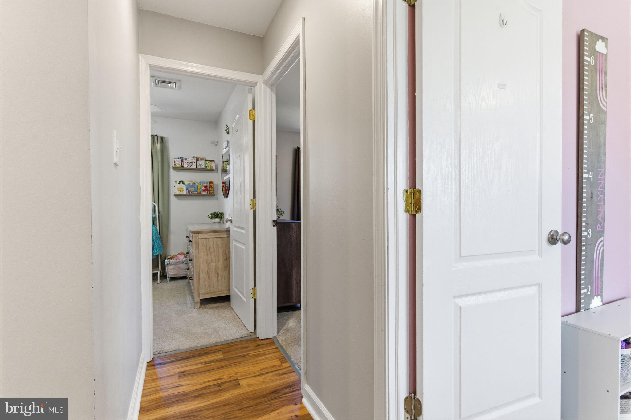 62 Oldbrook Road Levittown, PA 19057 - Photo 10 of 18 a view of a bedroom from a hallway