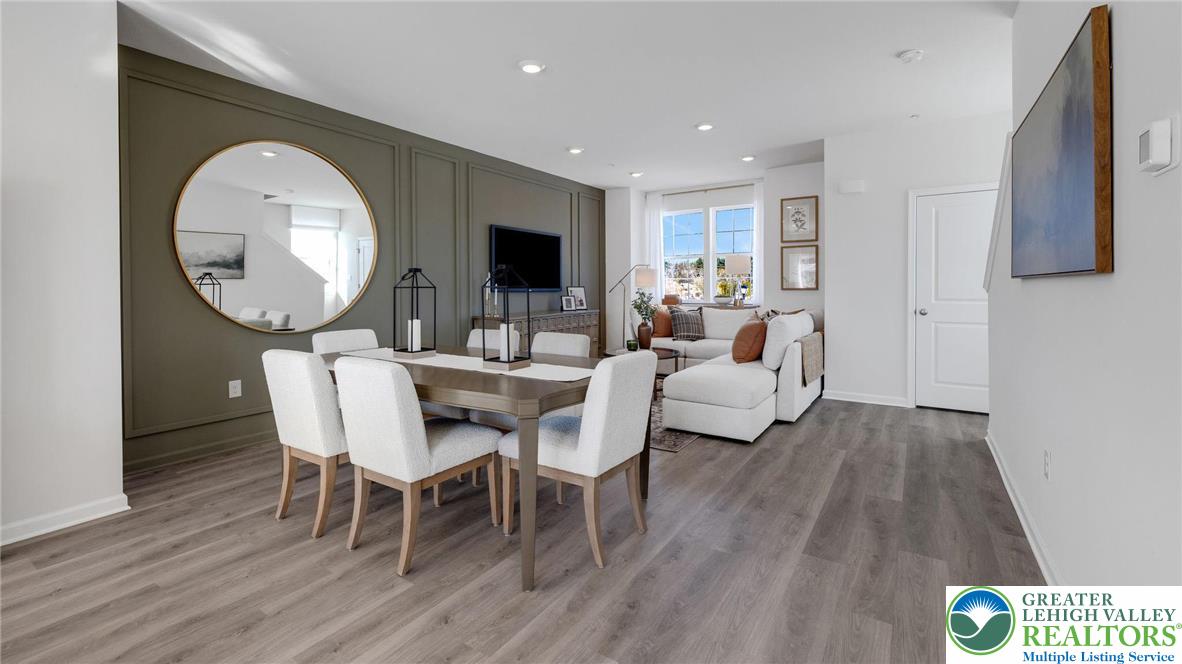 8344 Alexander Court Breinigsville, PA 18031 - Photo 12 of 25 a view of a dining room with furniture and wooden floor