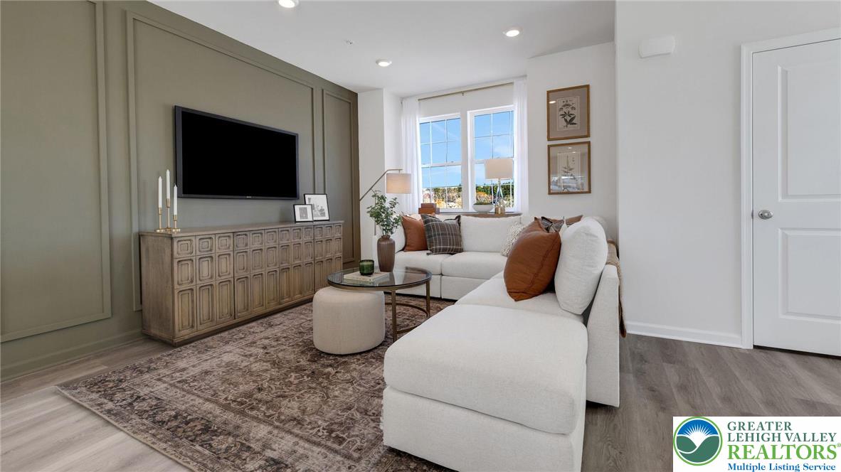 8344 Alexander Court Breinigsville, PA 18031 - Photo 13 of 25 a living room with furniture and a flat screen tv