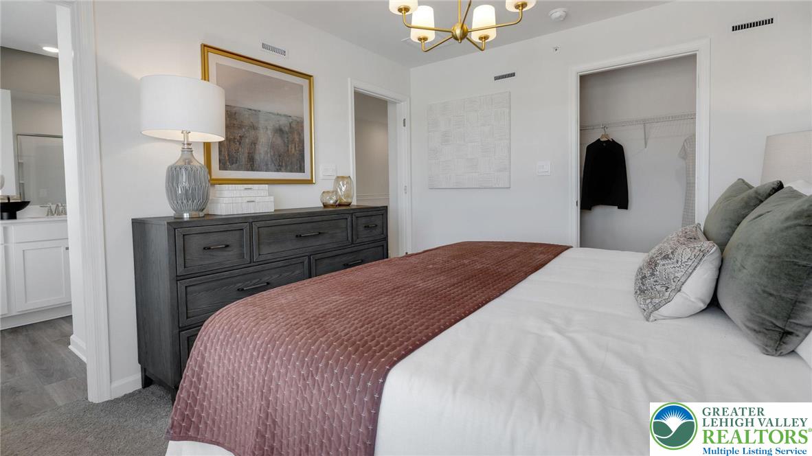 8344 Alexander Court Breinigsville, PA 18031 - Photo 20 of 25 a bedroom with a bed and a dresser