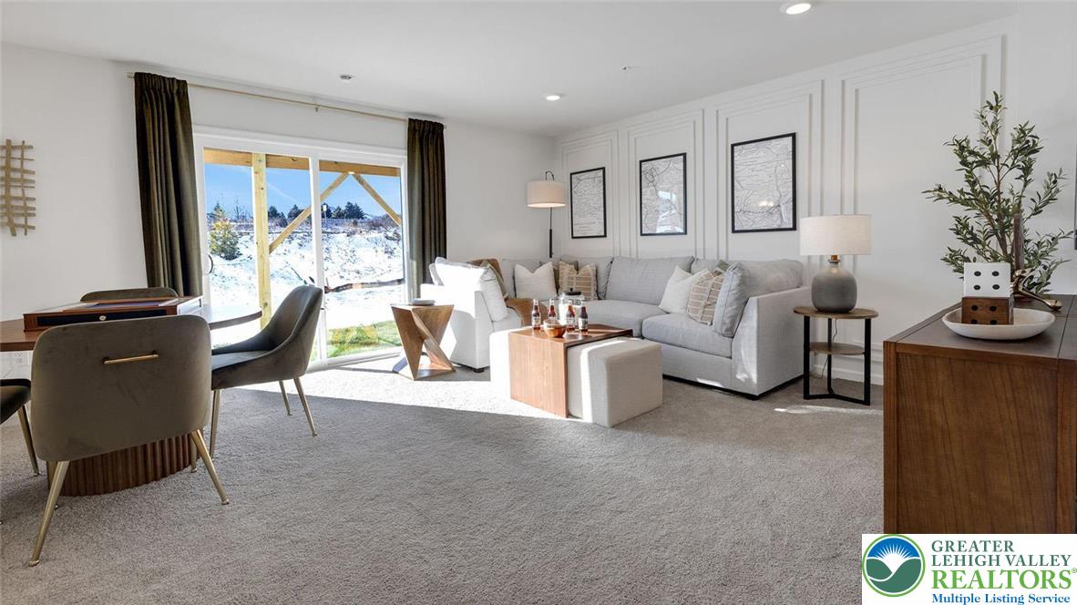 8344 Alexander Court Breinigsville, PA 18031 - Photo 4 of 25 a living room with furniture and a flat screen tv