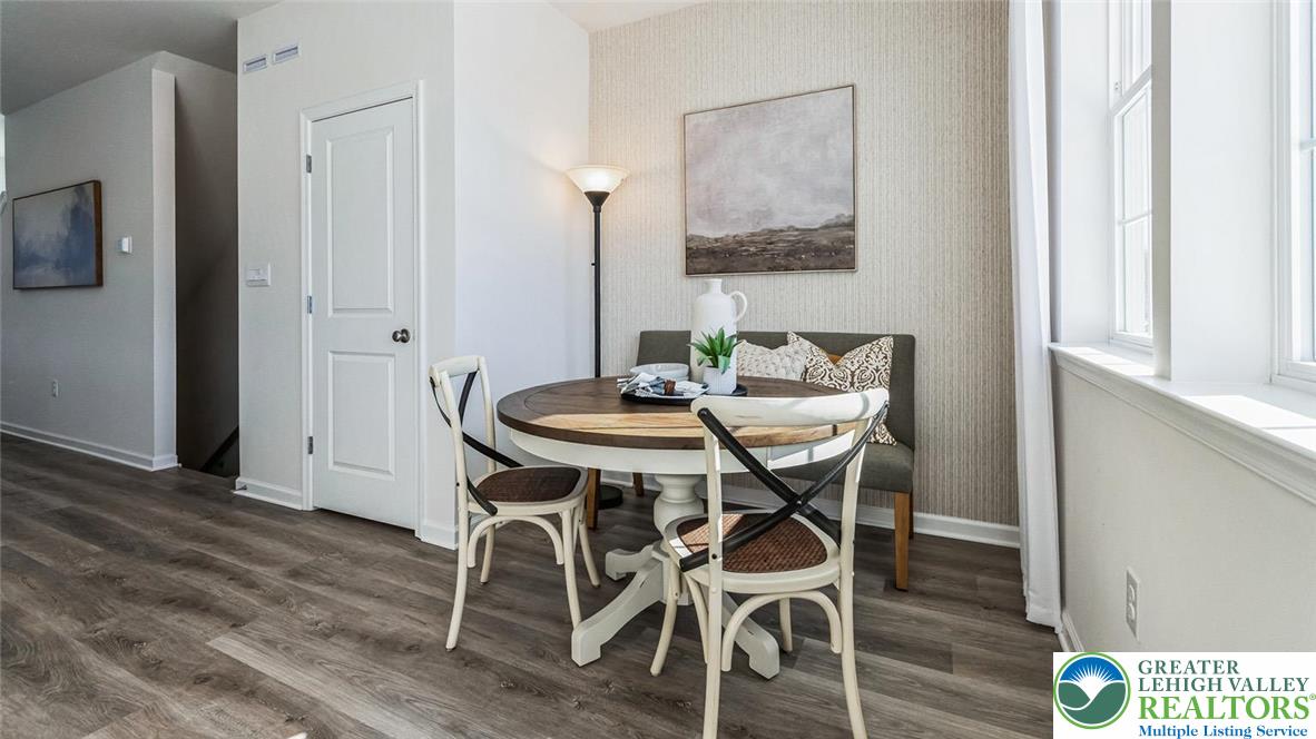 8344 Alexander Court Breinigsville, PA 18031 - Photo 10 of 25 a view of a dining room with furniture and wooden floor
