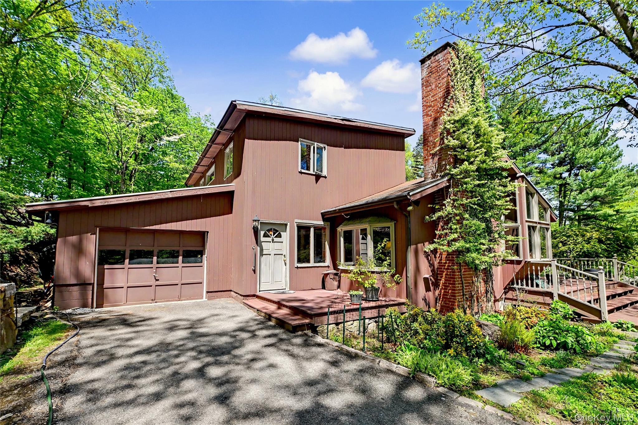 631 Croton Falls Road Carmel, NY 10512 - Photo 4 of 43 a front view of a house with garden