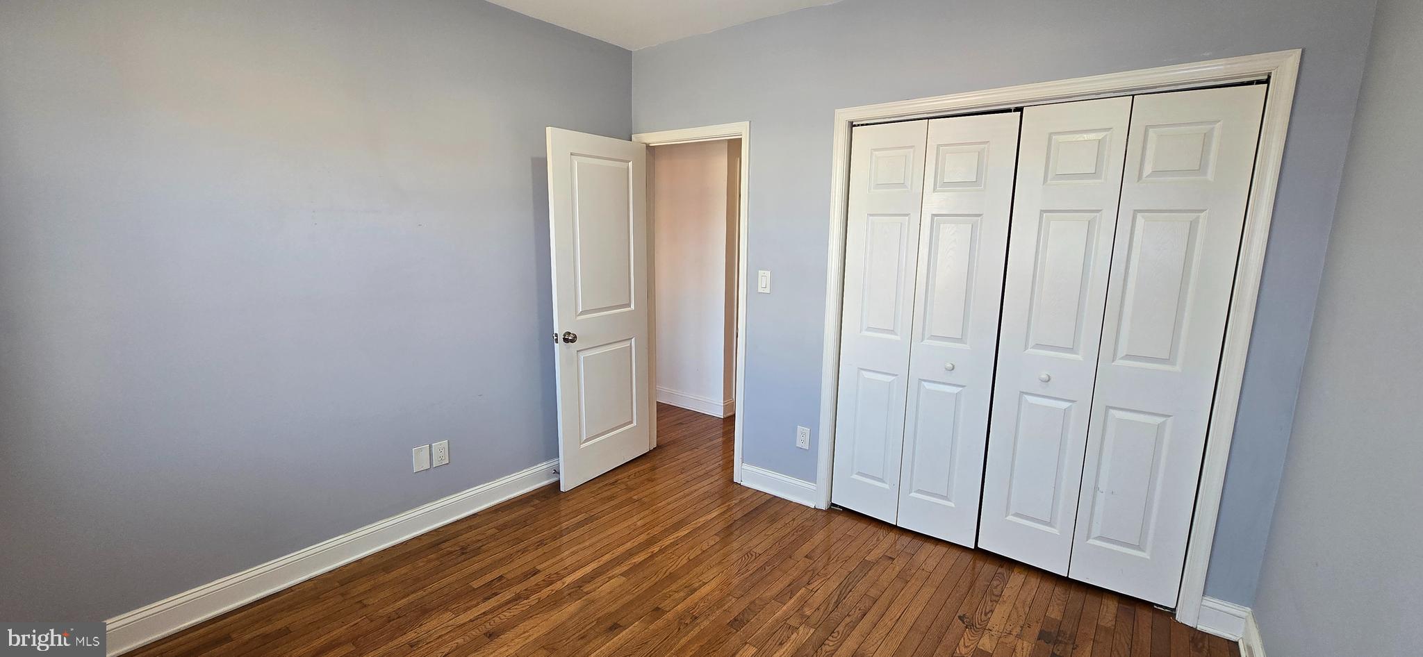 1835 Benning Road Northeast, Unit 1 Washington, DC 20002 - Photo 7 of 12 a view of an empty room with wooden floor