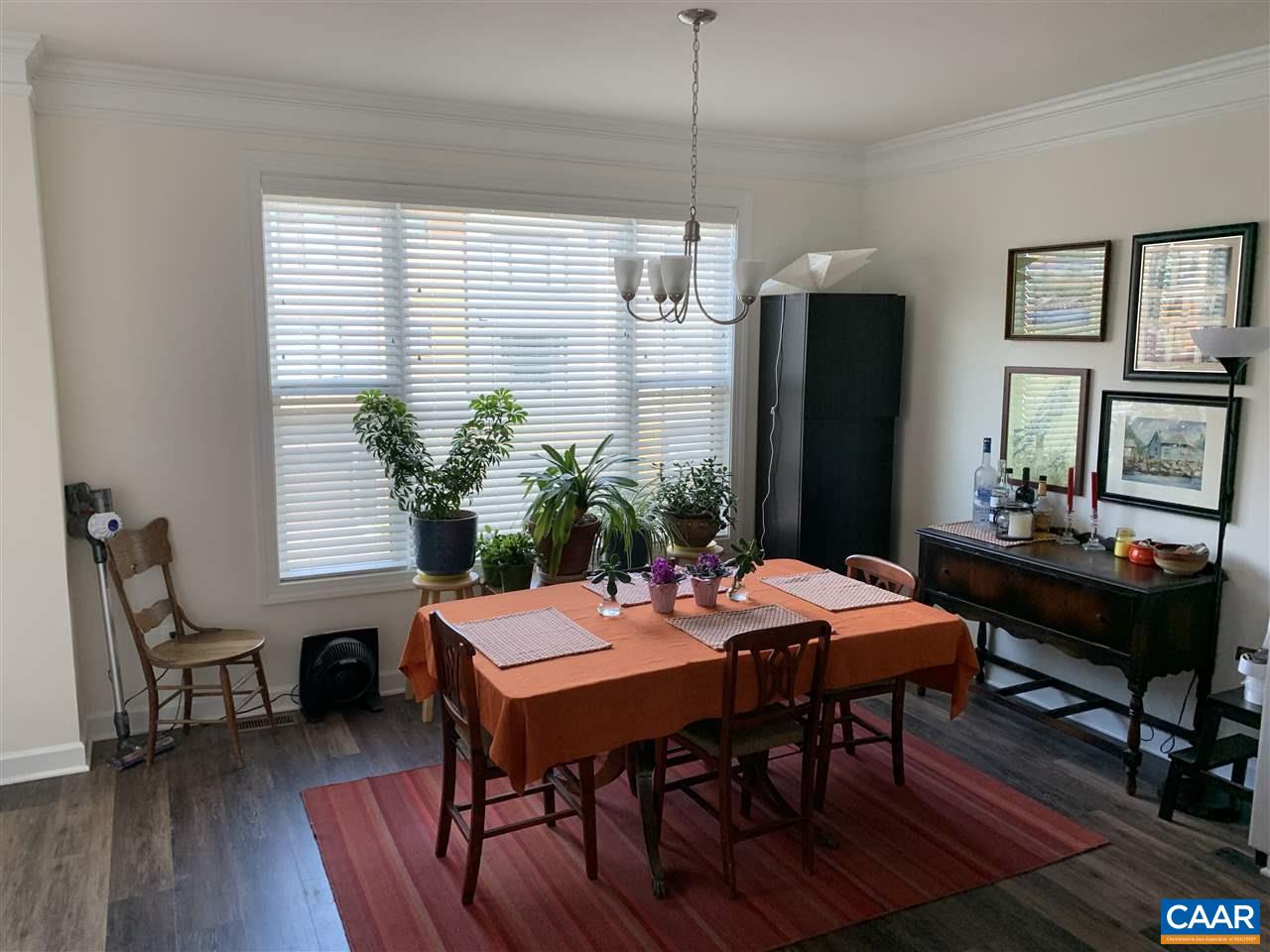 143 Junction Lane Charlottesville, VA 22902 - Photo 8 of 16 a view of a dining room with furniture window and wooden floor