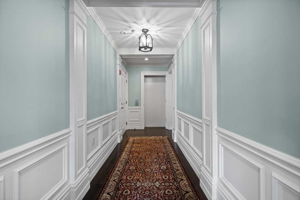 45 Commonwealth Avenue, Unit 4 Boston, MA 02116 - Photo 12 of 25 a view of a hallway view with wooden floor and staircase