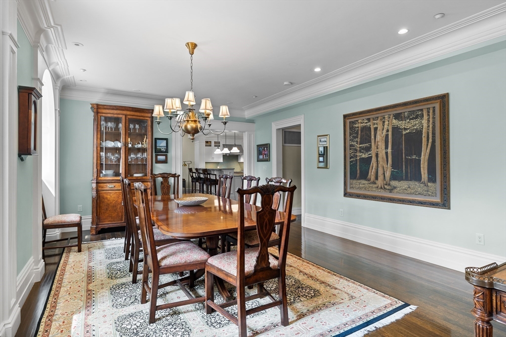 45 Commonwealth Avenue, Unit 4 Boston, MA 02116 - Photo 5 of 25 a dining room with furniture a chandelier and wooden floor