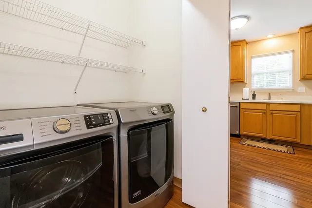 a view of a kitchen with a stove top oven