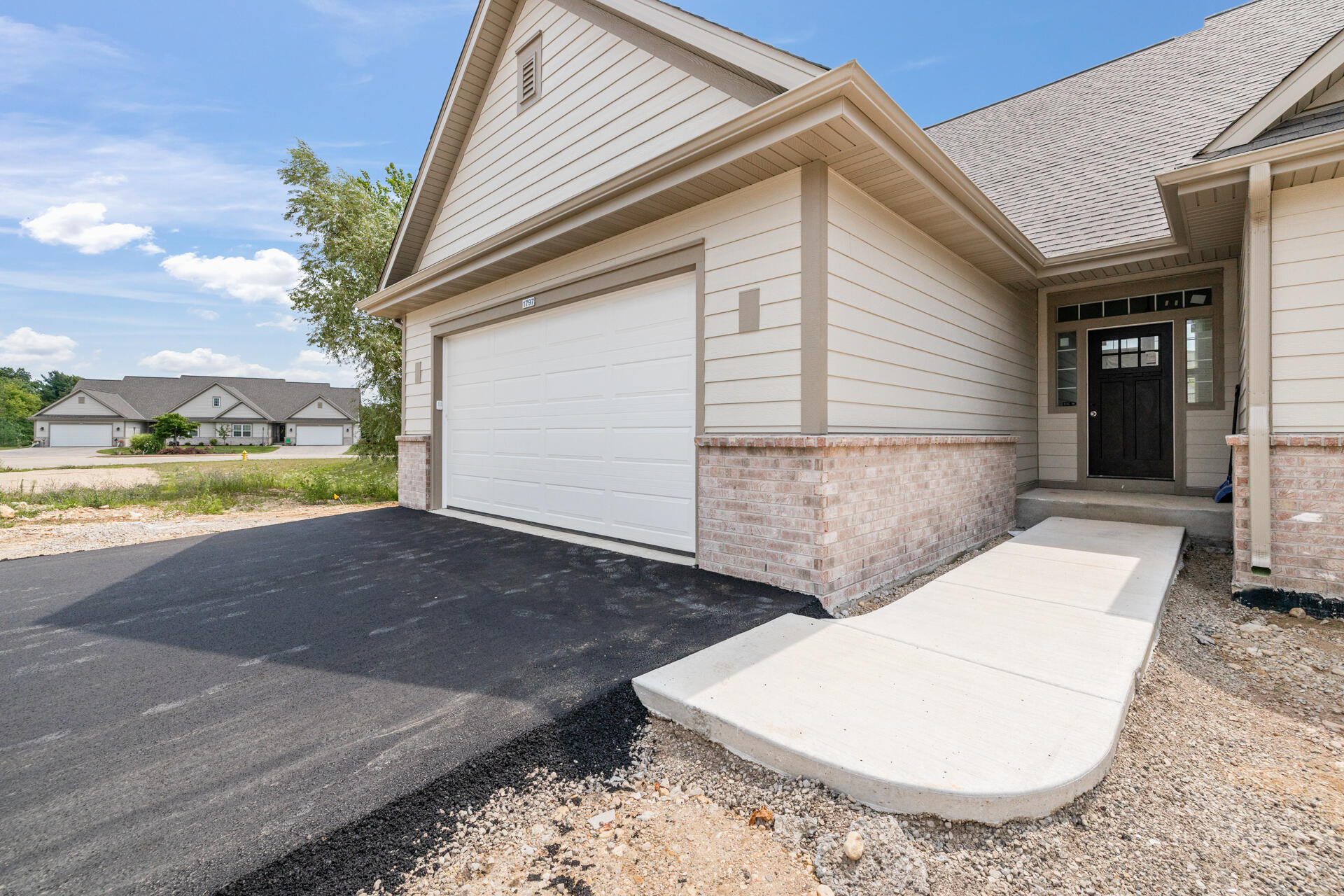 1797 Cedar Ridge Drive, Unit 2152 Slinger, WI 53086 - Photo 5 of 39 6-Exterior_1797 Cedar Ridge