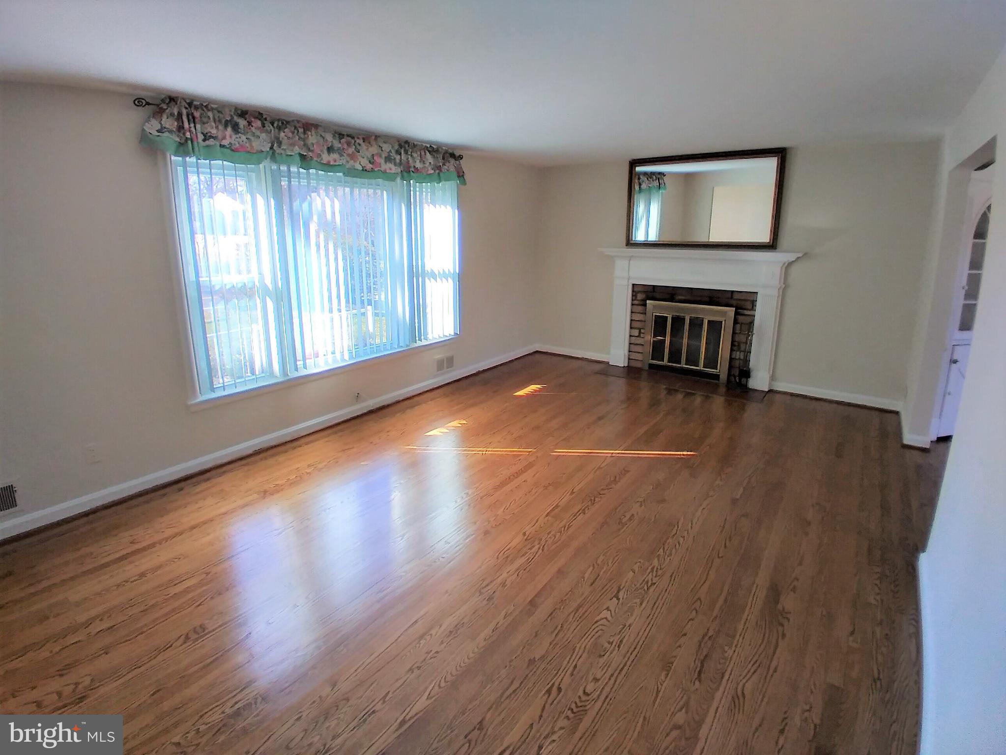 3919 Chesterbrook Road Arlington, VA 22207 - Photo 2 of 21 Formal Living Room with wood burning fireplace