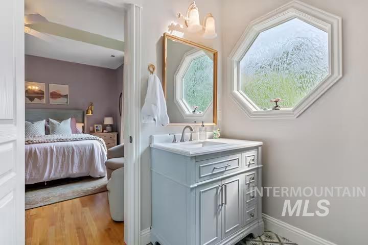 1617 North 5th Street Boise, ID 83702 - Photo 16 of 36 Bathroom featuring vanity, ensuite bath, and light wood finished floors