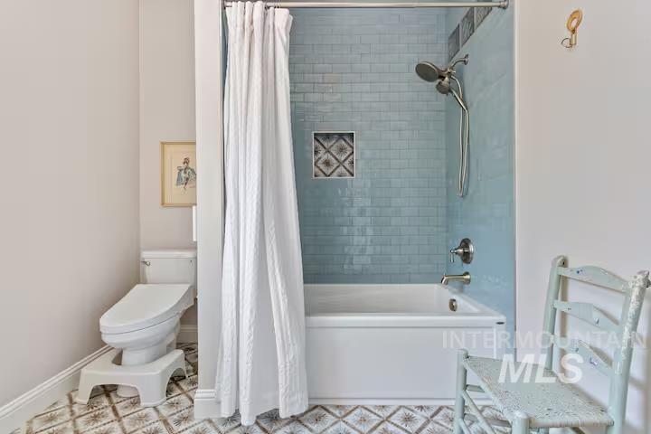 1617 North 5th Street Boise, ID 83702 - Photo 17 of 36 Bathroom featuring shower / tub combo and toilet