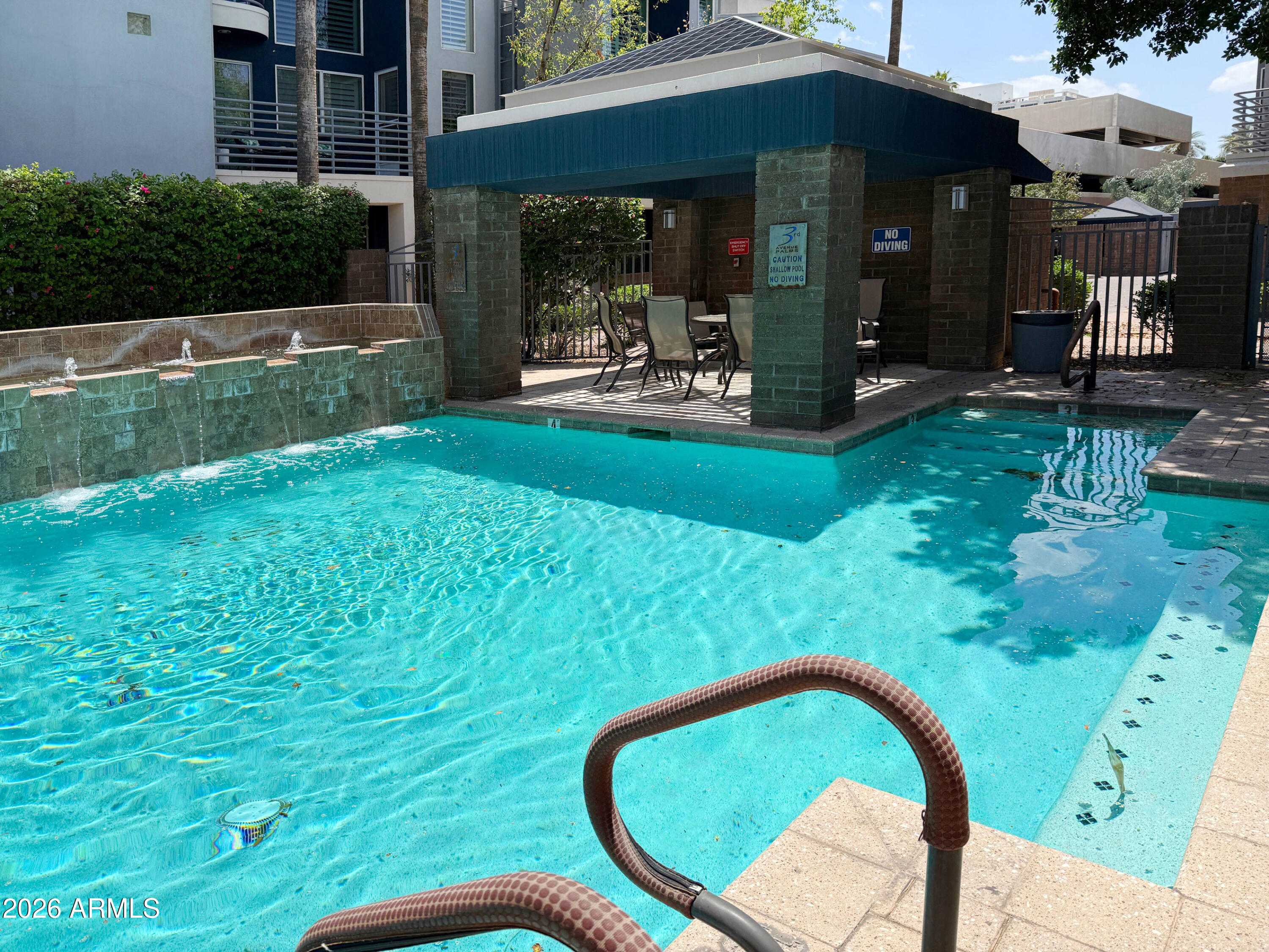 3633 North 3rd Avenue, Unit 1027 Phoenix, AZ 85013 - Photo 29 of 29 a view of a chair and table in backyard of the house