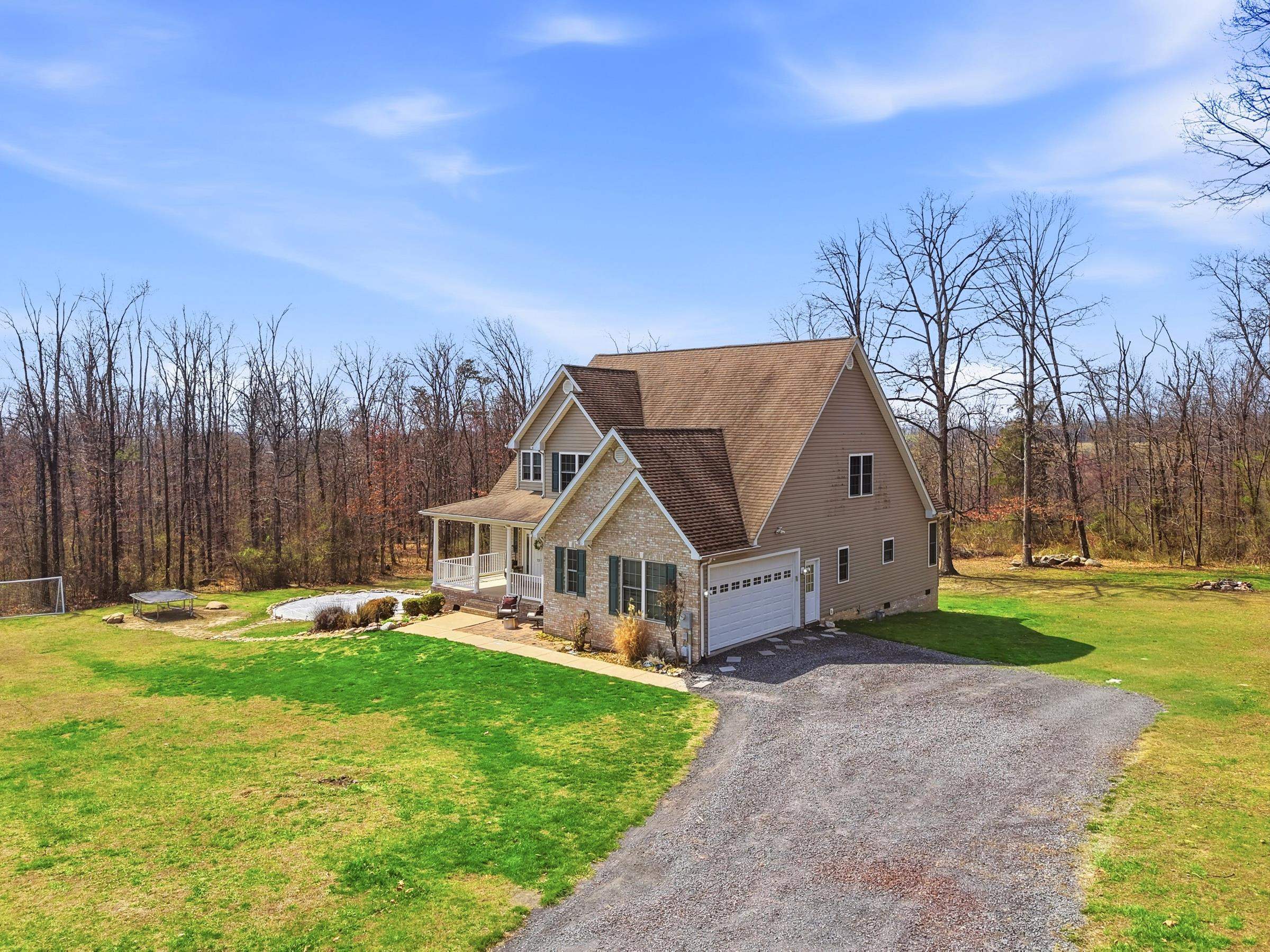 257 Hunter Road Maurertown, VA 22644 - Photo 59 of 61 a view of a house with garden and trees