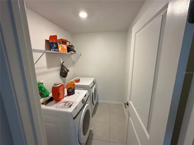 a storage room with washer and dryer