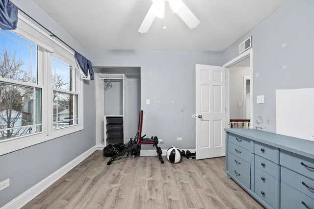 a view of a room with window and wooden floor