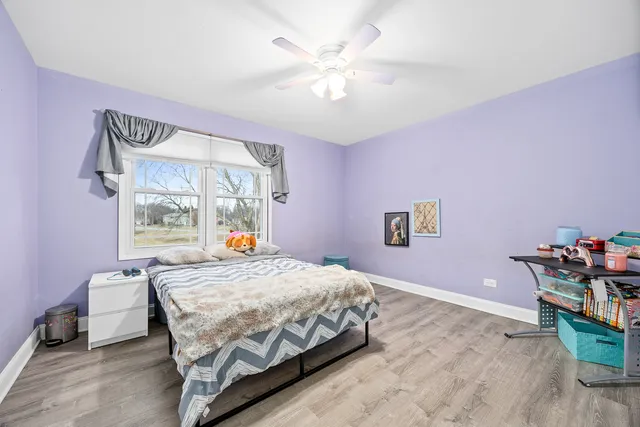 a bedroom with a bed and a table in it