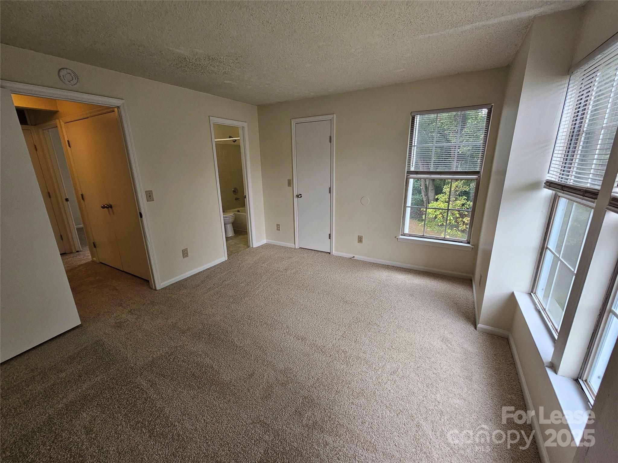 9619 Vinca Circle, Unit B Charlotte, NC 28213 - Photo 11 of 18 a view of an empty room with a window
