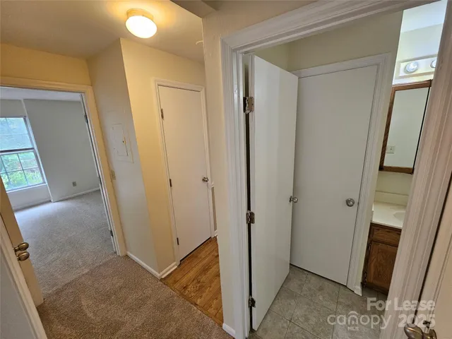 a view of a hallway with closet area