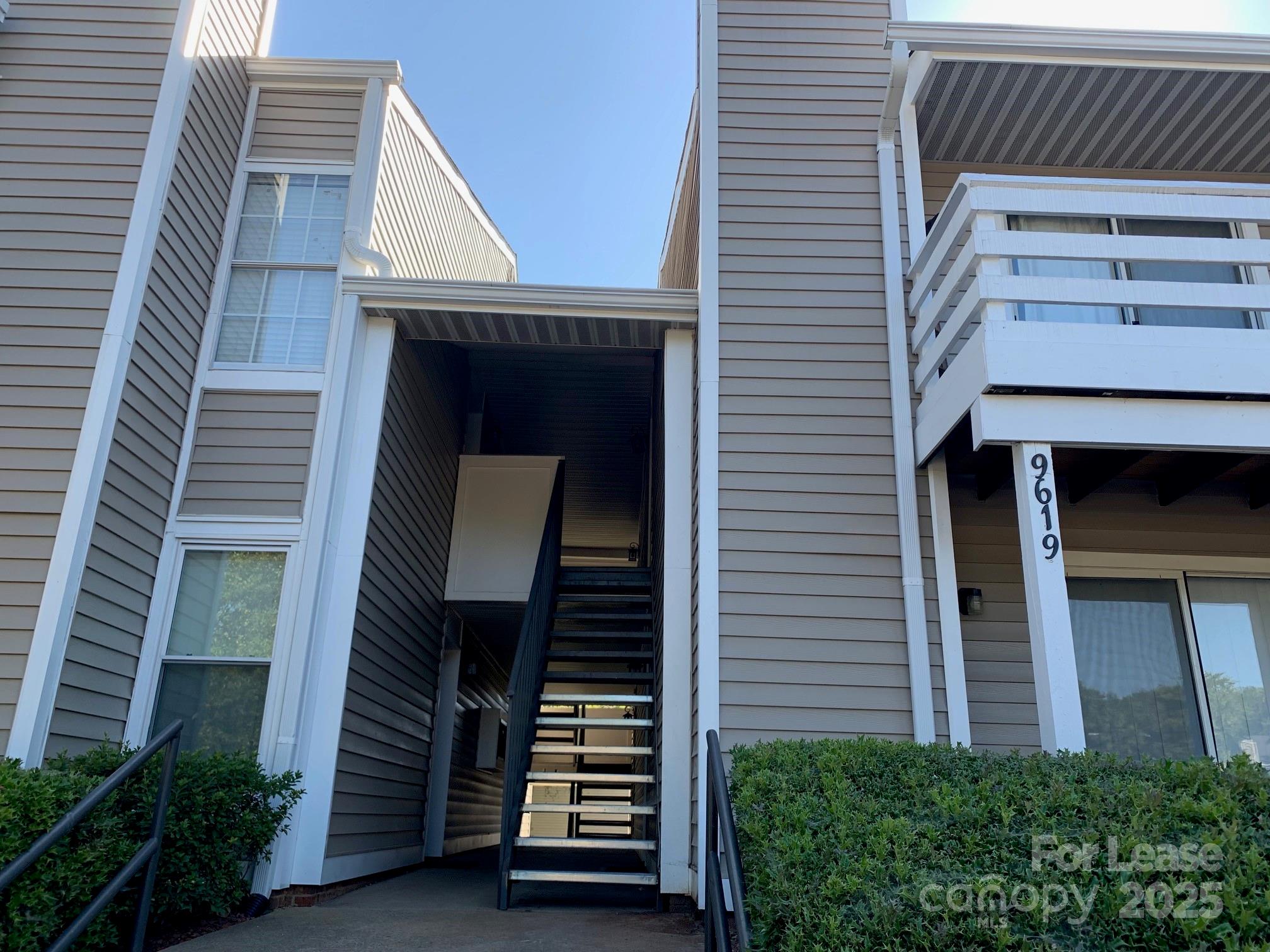 9619 Vinca Circle, Unit B Charlotte, NC 28213 - Photo 2 of 18 a front view of a house with stairs