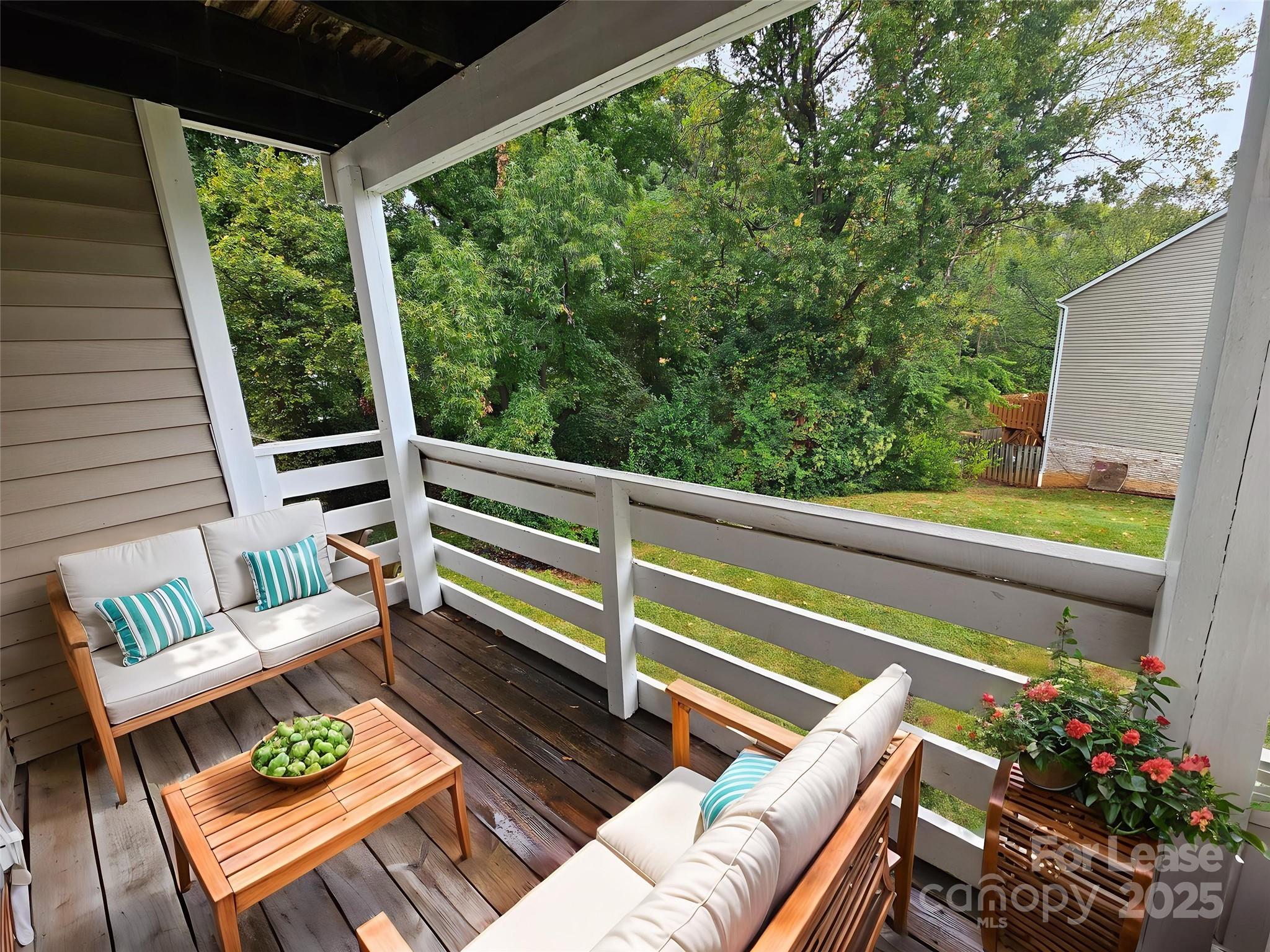 9619 Vinca Circle, Unit B Charlotte, NC 28213 - Photo 9 of 18 a view of a chair and tables in the balcony