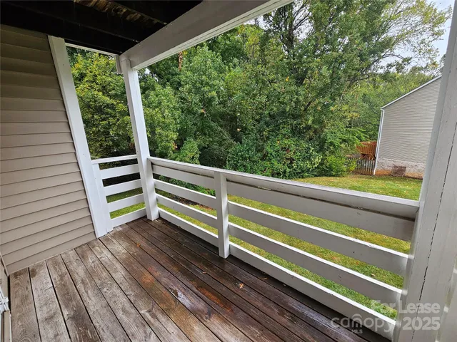 a view of a two chairs in the balcony