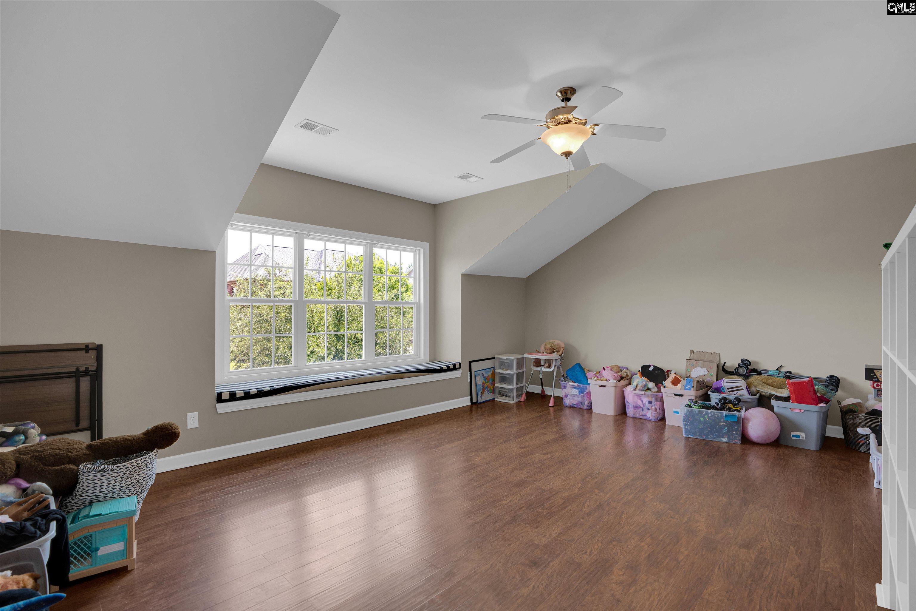 321 Asa Rose Lexington, SC 29072 - Photo 36 of 52 a living room with furniture and a chandelier