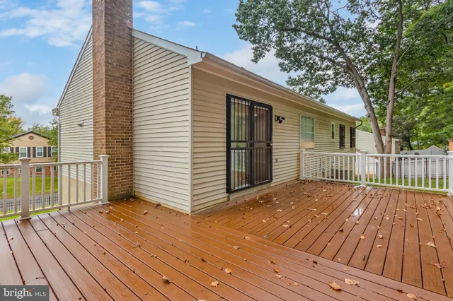 a view of backyard with a deck
