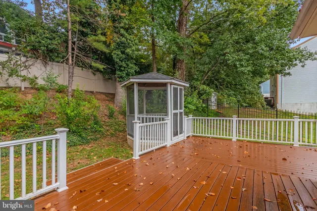 a view of a deck with wooden floor and fence
