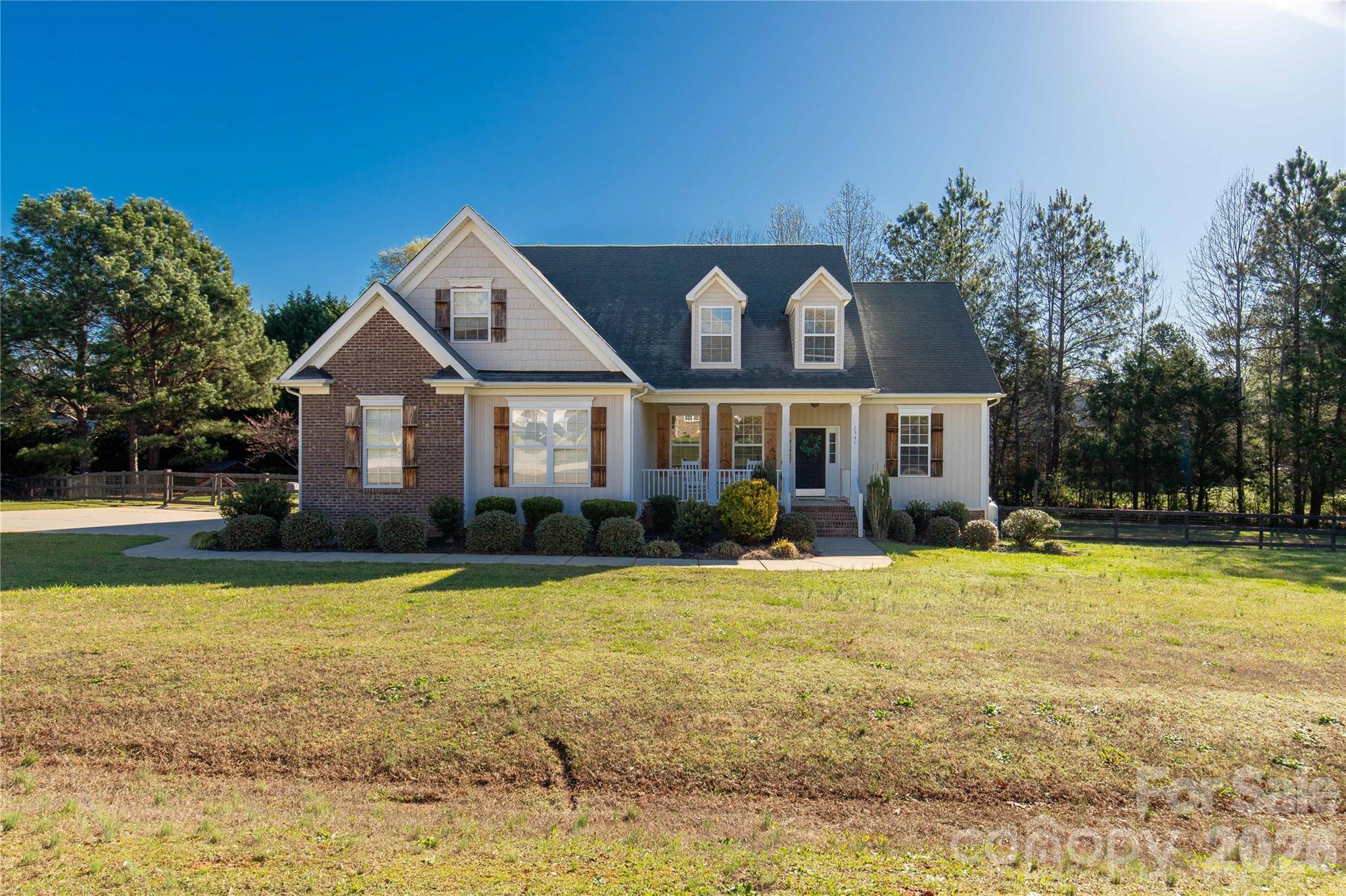 2341 Valley Meadows Drive York, SC 29745 - Photo 1 of 46 a front view of a house with swimming pool having outdoor seating