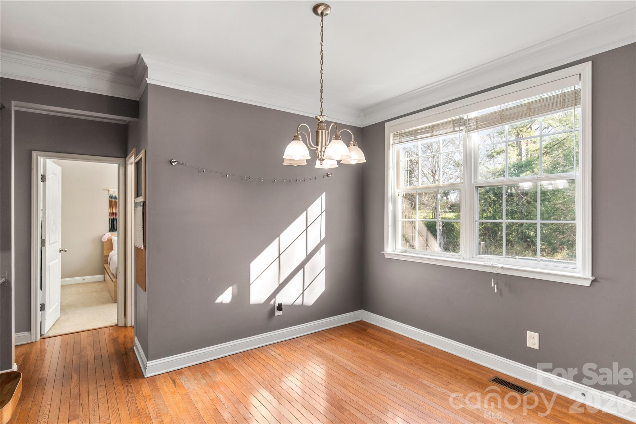 2341 Valley Meadows Drive York, SC 29745 - Photo 12 of 46 a view of an empty room with wooden floor and a window