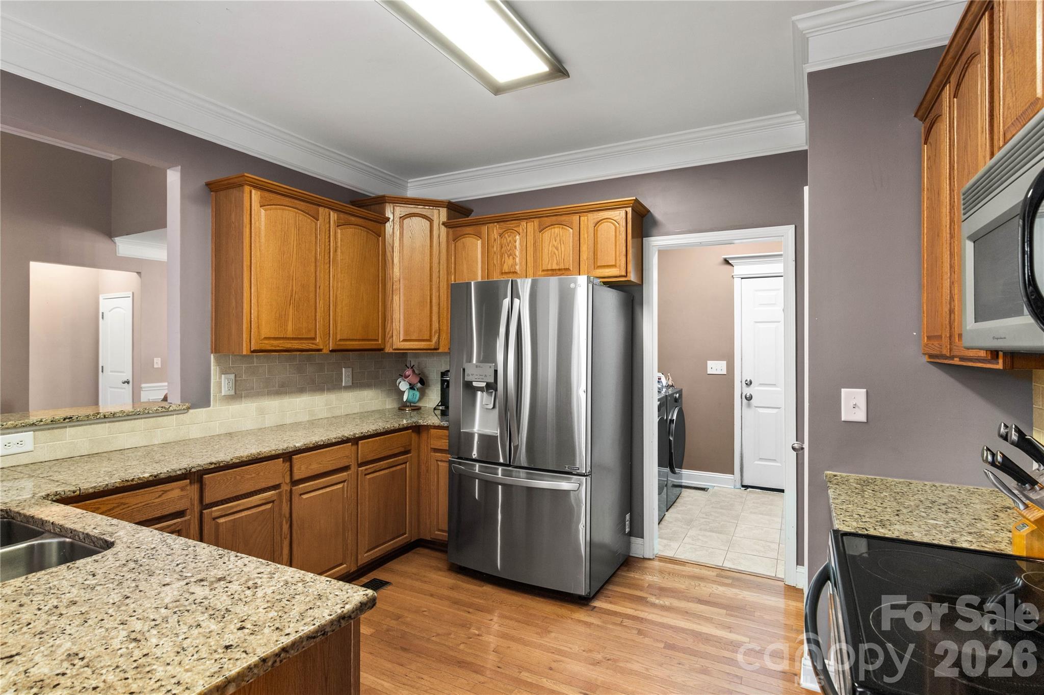 2341 Valley Meadows Drive York, SC 29745 - Photo 14 of 46 a kitchen with stainless steel appliances granite countertop a refrigerator and a sink