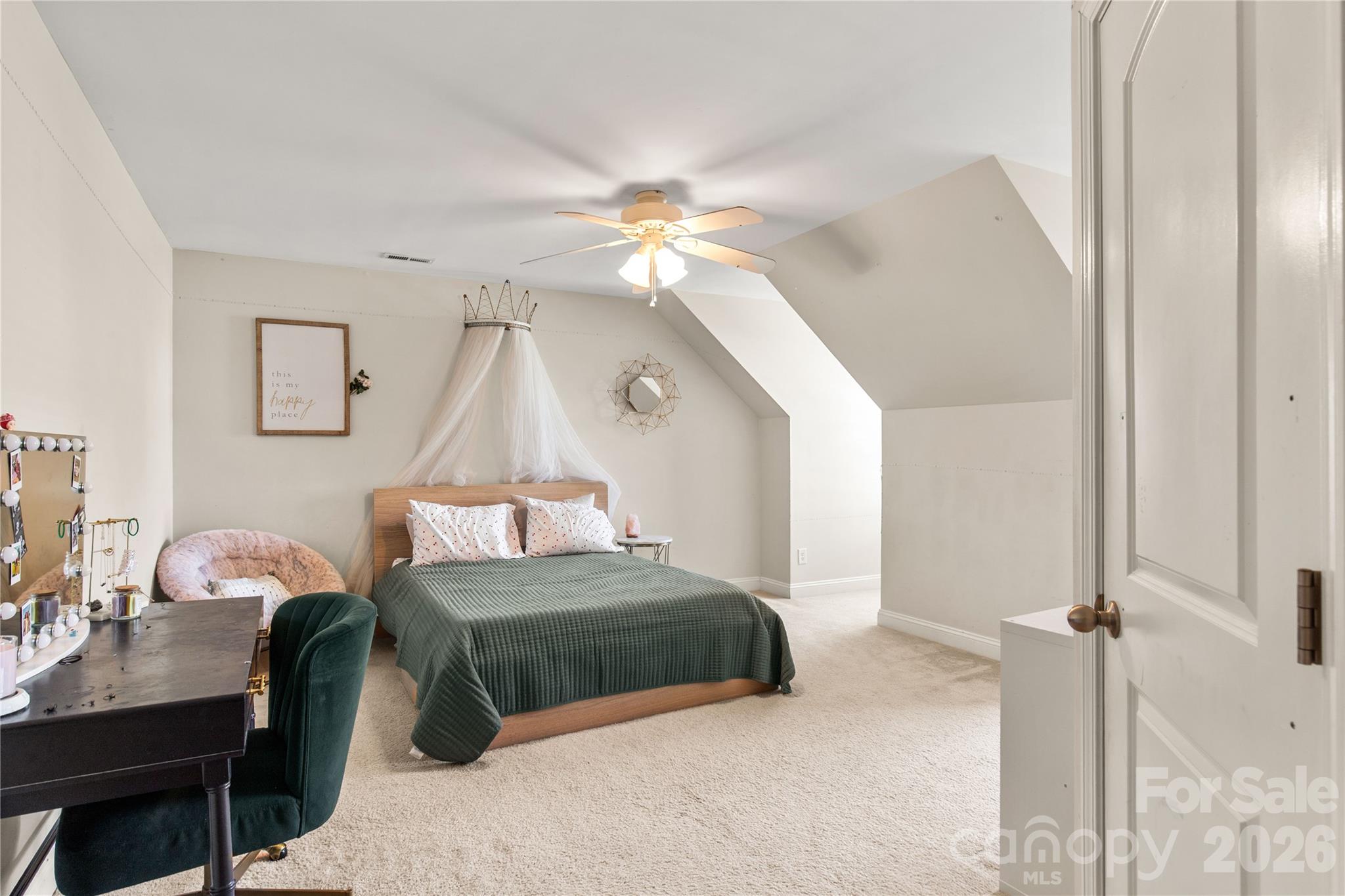 2341 Valley Meadows Drive York, SC 29745 - Photo 30 of 46 a bedroom with a bed and a chandelier