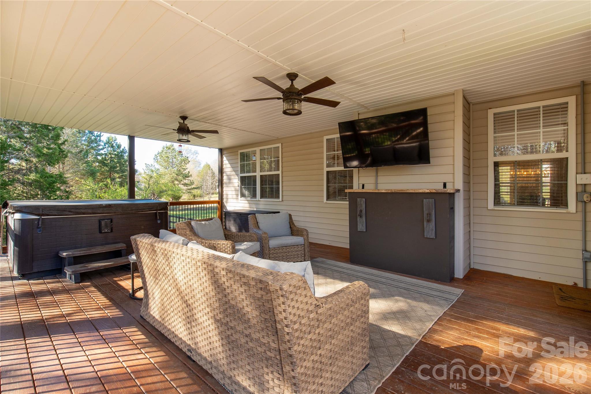 2341 Valley Meadows Drive York, SC 29745 - Photo 33 of 46 a living room with couches a flat screen tv and kitchen view