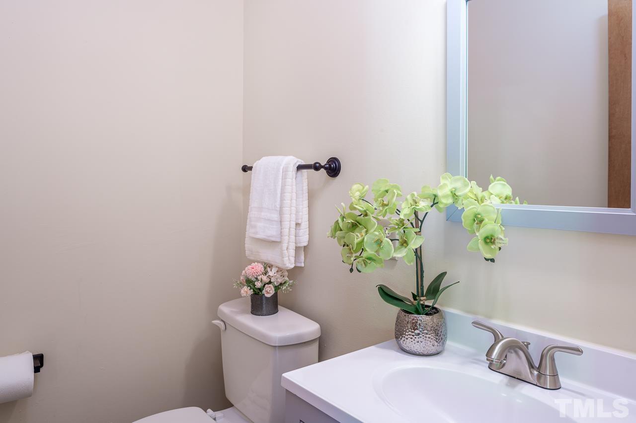 4264 Kaplan Drive Raleigh, NC 27606 - Photo 11 of 23 a bathroom with a toilet and sink
