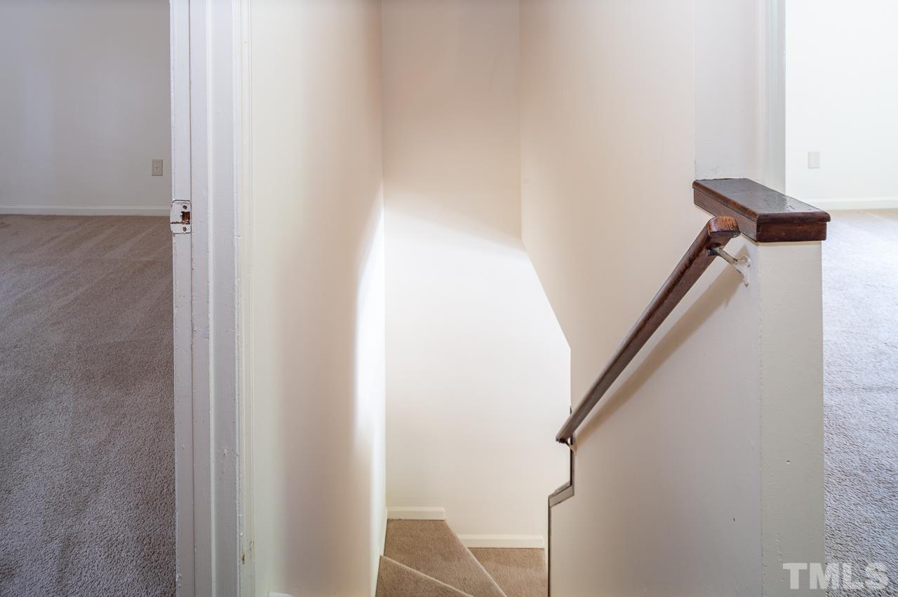 4264 Kaplan Drive Raleigh, NC 27606 - Photo 12 of 23 a view of hallway with stairs