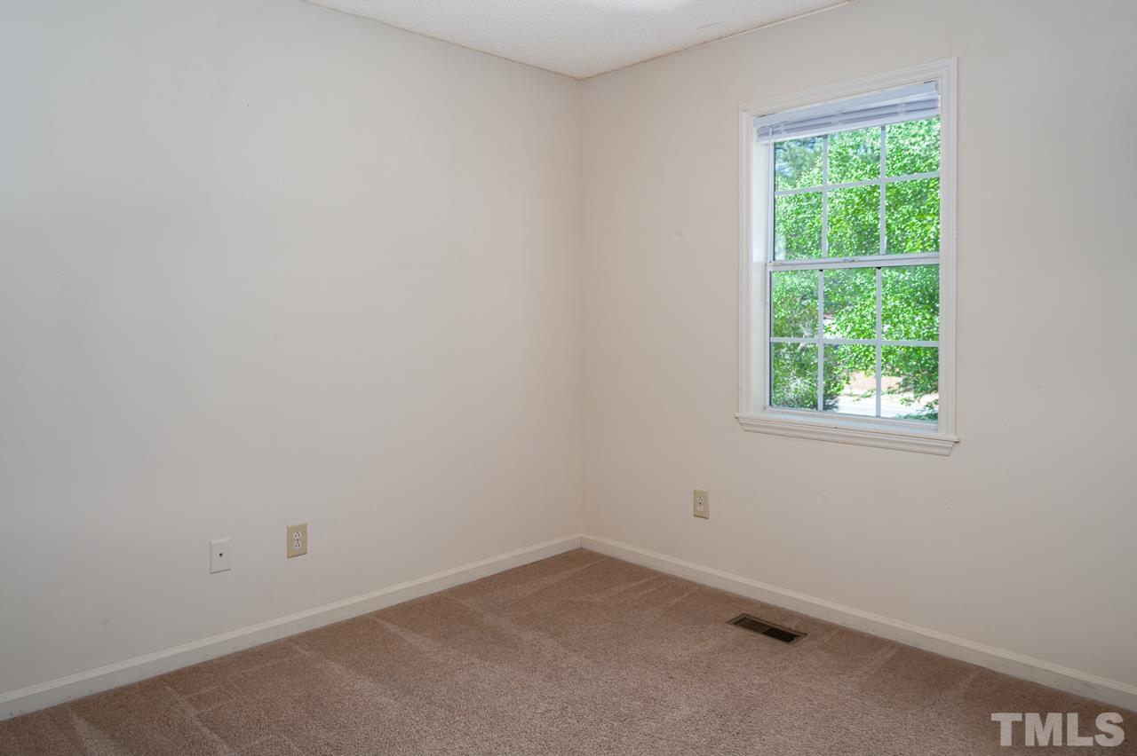 4264 Kaplan Drive Raleigh, NC 27606 - Photo 19 of 23 an empty room with a window