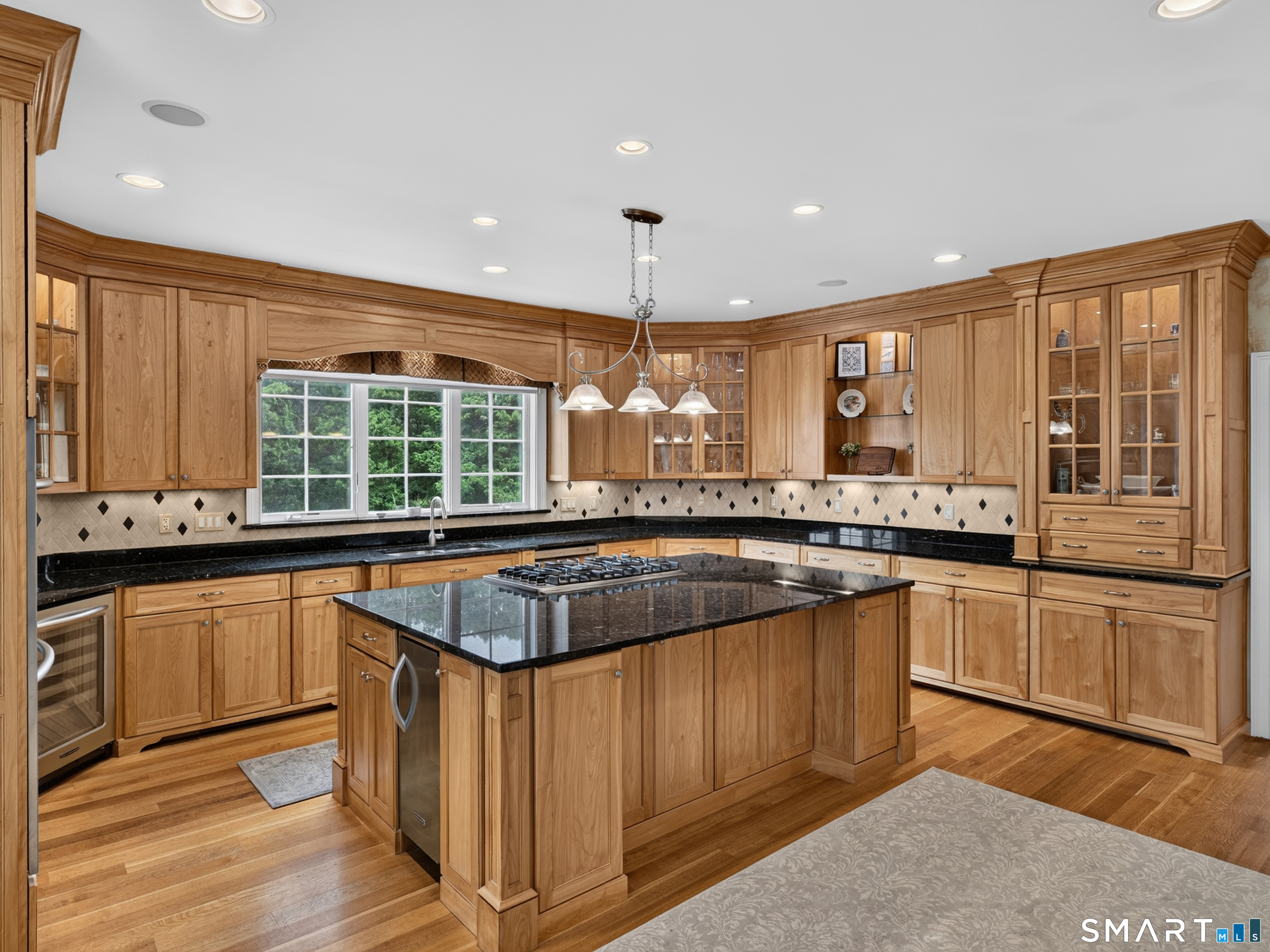 55 Hunters Ridge Rocky Hill, CT 06067 - Photo 10 of 40 a kitchen with stainless steel appliances granite countertop a stove a sink and a microwave