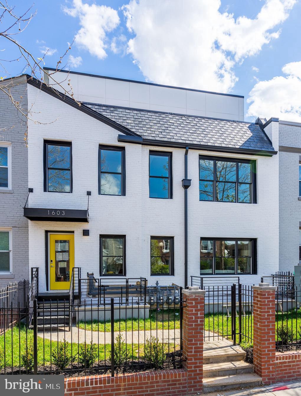 1603 Isherwood Street Northeast, Unit 2 Washington, DC 20002 - Photo 2 of 24 a front view of a house with a garden