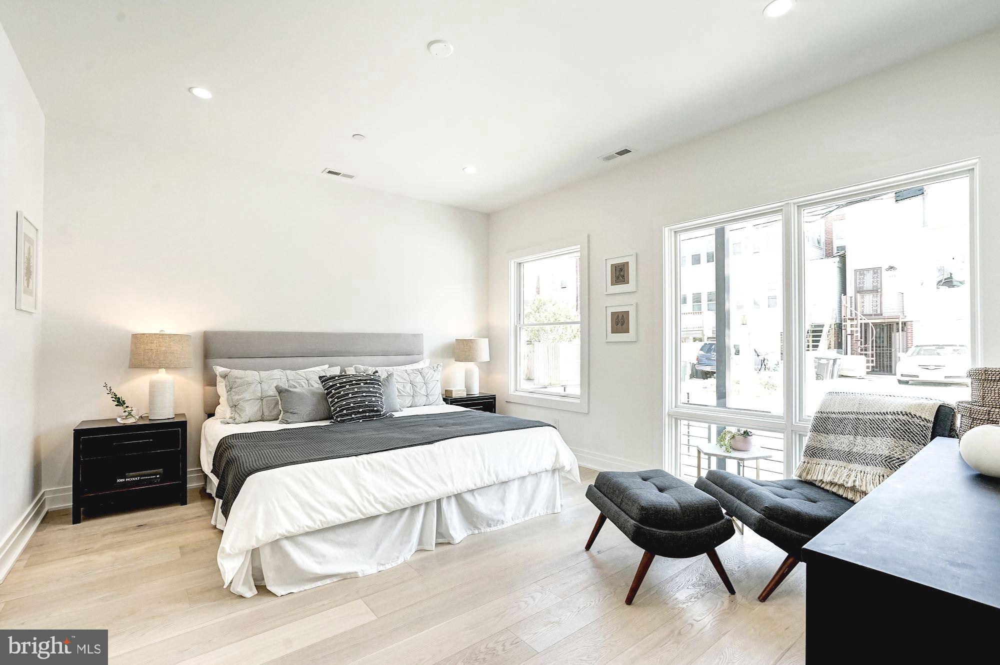 1603 Isherwood Street Northeast, Unit 2 Washington, DC 20002 - Photo 18 of 24 a bedroom with a bed and a large window