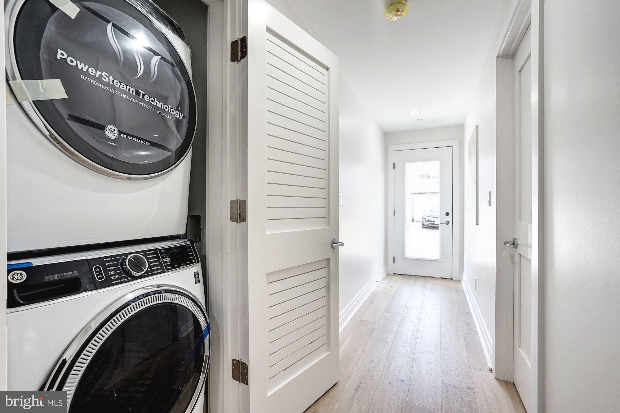 1603 Isherwood Street Northeast, Unit 2 Washington, DC 20002 - Photo 21 of 24 a view of a hallway with washer and dryer