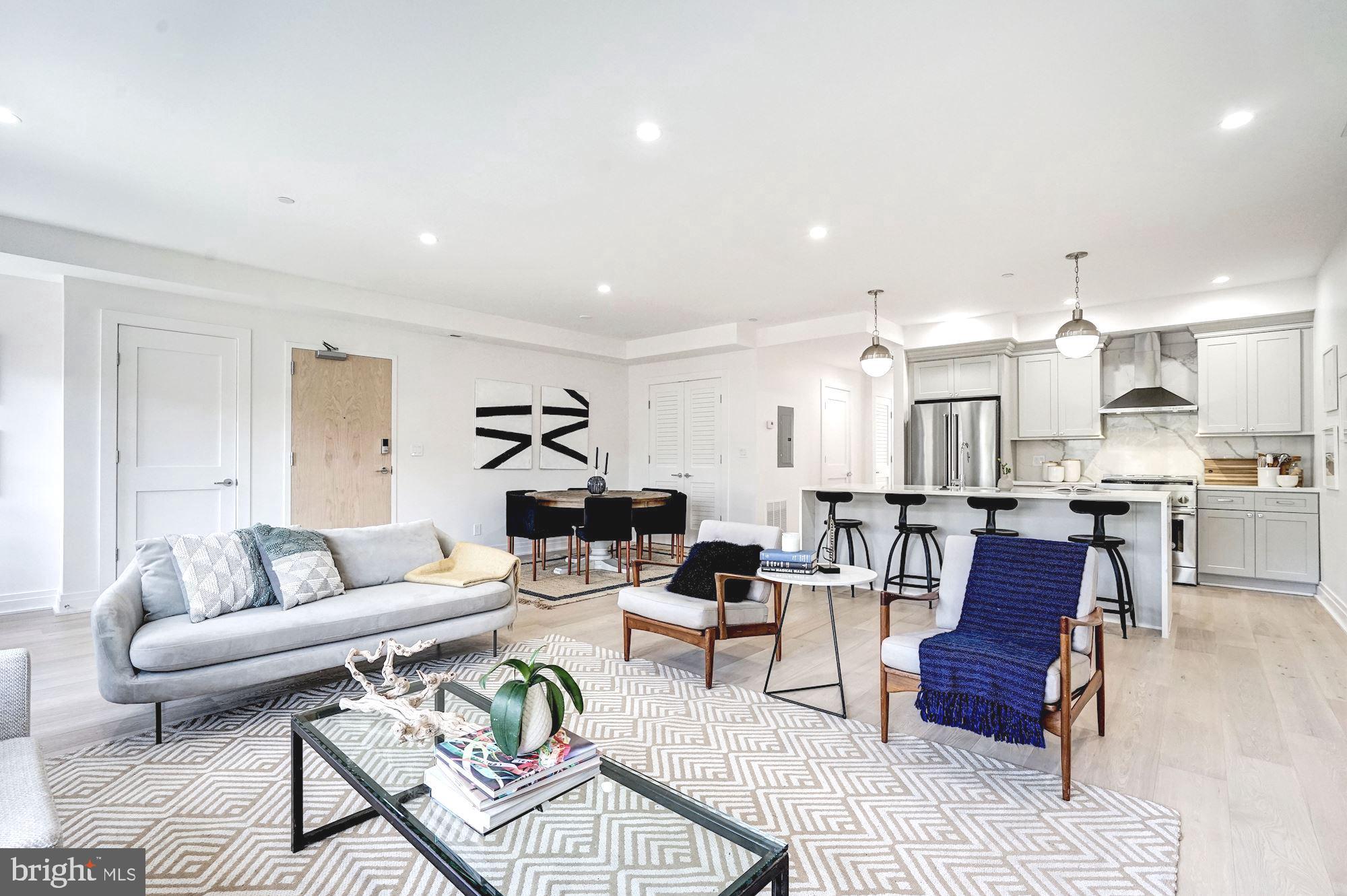 1603 Isherwood Street Northeast, Unit 2 Washington, DC 20002 - Photo 5 of 24 a living room with furniture and kitchen view