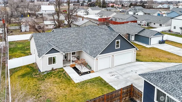 an aerial view of a house with swimming pool